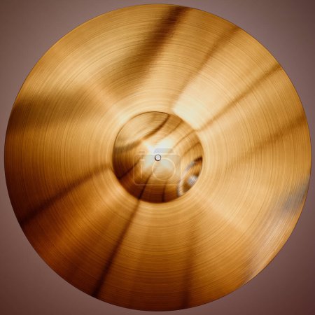 Photo for Captivating close-up shot of a lustrous golden cymbal, highlighting the intricate grooves and craftsmanship, complemented by a subtle gradient background that enhances its elegance. - Royalty Free Image