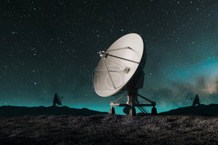 Foto de Una serie de radiotelescopios a gran escala escanea meticulosamente la inmensidad de los cielos estrellados nocturnos, en un terreno accidentado, capturando fenómenos cósmicos. - Imagen libre de derechos
