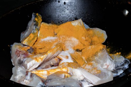 Photo for Fresh fish meat slices for preperation, fish cooking turmeric powder and salt - Royalty Free Image