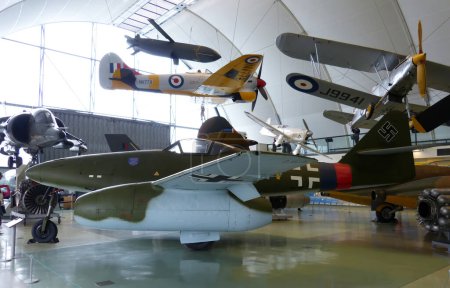 Photo for Hendon, London - England, UK - June 29, 2014: Royal Air Force (RAF) Museum. Real historic aircrafts from all over the world. In foreground a German Me 262. - Royalty Free Image