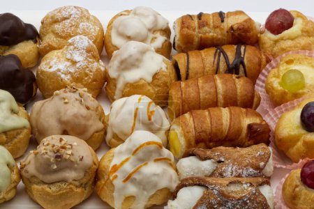 Photo for Tray of small delicious Italian pastries. Mignon high pastry Italian style. Typical Italian dessert. Close-up - Royalty Free Image
