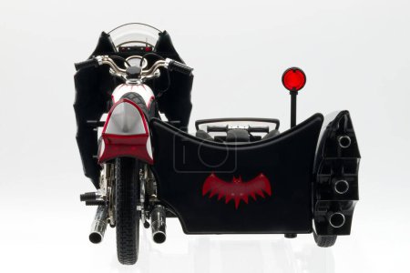 Photo for Bologna - Italy - October 24, 2023: Batman Batcycle with sidecar isolated on white background. Batcycle diecast replica 1:18 scale from 1966 Batman Movie. - Royalty Free Image