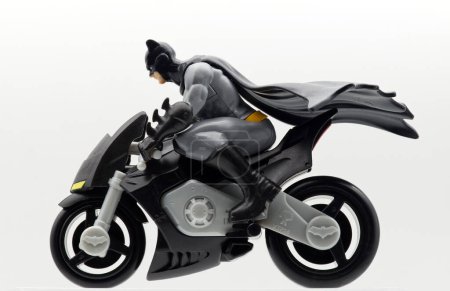 Photo for Bologna - Italy - April 5, 2024: Batman Batcycle isolated on white background. Plastic Batcycle model by Kinder. - Royalty Free Image
