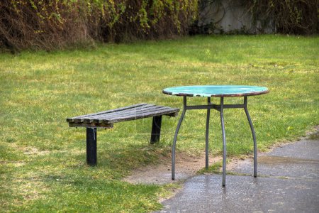 Photo for Old table and bench in the garden - Royalty Free Image