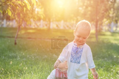 Photo for Children in summer in Ukrainian national dress - vyshyvanka in nature. - Royalty Free Image
