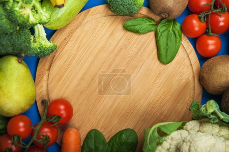 Photo for Heart made of fresh vegetables and fruit on wooden background. - Royalty Free Image