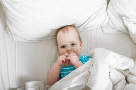 Photo for Baby 11 months old on the bed getting ready to sleep - Royalty Free Image