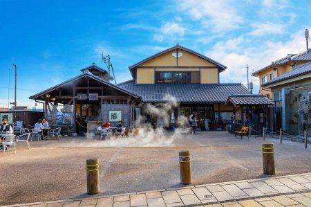 Photo for Beppu, Japan - Nov 25 2022: Steam Cooking Center in Beppu, Tourists have the opportunity to steam their own meals at the Jigokumushi Kobo near the hells of the Kannawa District - Royalty Free Image