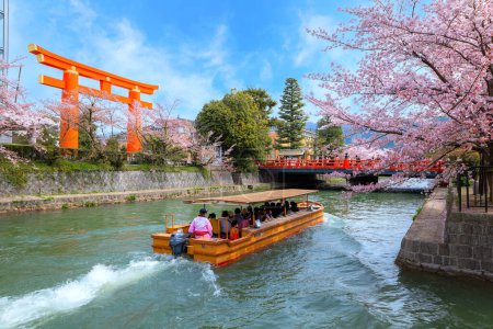 Photo for Kyoto, Japan - April 2 2023: Okazaki Jikkokubune Boat Ride runs a three kilometers cruise from Nanzenji boat pier to Ebisu Dam and back round trip - Royalty Free Image