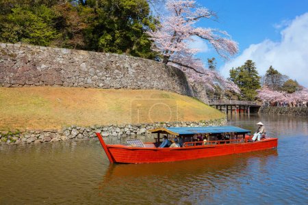 Photo for Shiga, Japan - April 3 2023: Hikone Castle Yakatabune Cruise is a sightseeing tour around the castle moat in a reconstructed boat - Royalty Free Image
