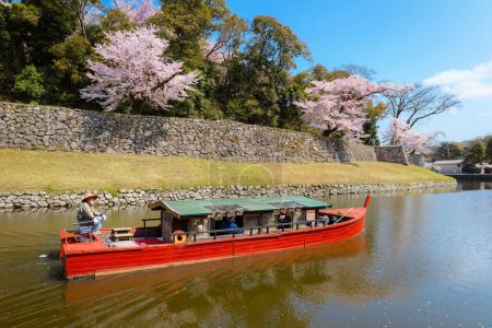 Photo for Shiga, Japan - April 3 2023: Hikone Castle Yakatabune Cruise is a sightseeing tour around the castle moat in a reconstructed boat - Royalty Free Image