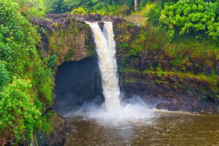 Natural beauty of Hawaii's summer landscape: majestic waterfall and cascading water in Wailuku River State Park.