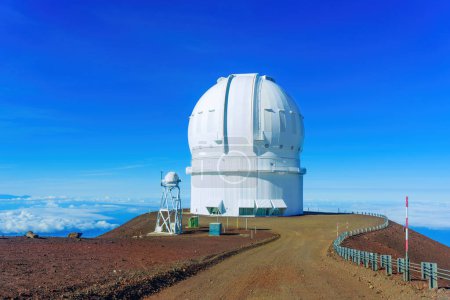 Photo for Mauna Kea's Observatory facility stands tall against a backdrop of pure blue sky, inviting the viewer to explore the mysteries of the cosmos. - Royalty Free Image
