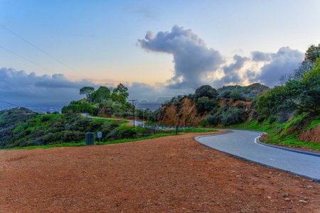 Photo for View of the winding track of the Runyon Canyon hiking trail at sunset. - Royalty Free Image