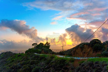 Photo for Los Angeles, California - January 6, 2023: View of the Runyon Canyon and the City under the Dramatic Sky at Sunset - Royalty Free Image