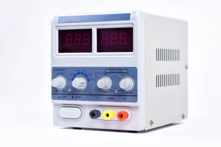 Close-up of a laboratory power supply unit having maximum output voltage of 15 volts.