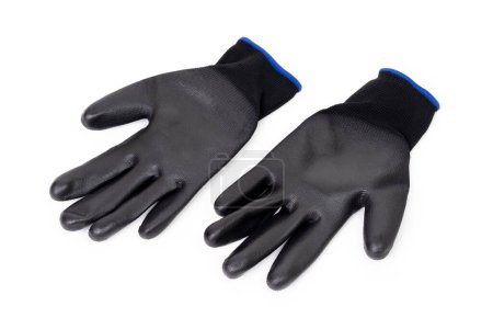 Top view of a pair of black PU gloves isolated on white background. Hand protection related concept.