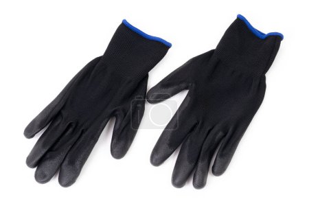 Primer plano de un par de guantes protectores negros aislados sobre fondo blanco. Concepto de equipo de protección individual.