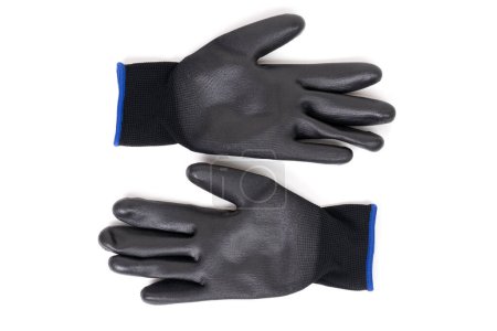 Un par de guantes de trabajo negros con una capa protectora de poliuretano sobre un fondo blanco.