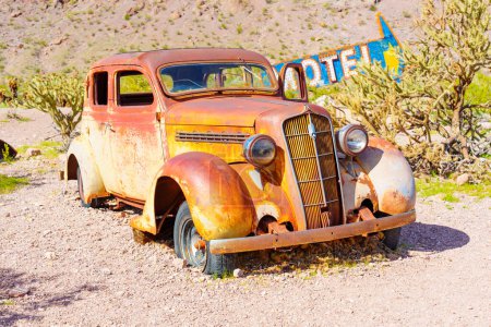 Photo for Nelson, Nevada - April 15, 2024: Weathered vintage car sits in the middle of a desert - Royalty Free Image