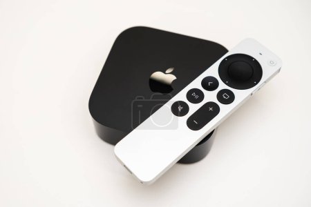 Photo for Apple TV 4k and remote controller on the white background, February 2023, Prague, Czech Republic - Royalty Free Image