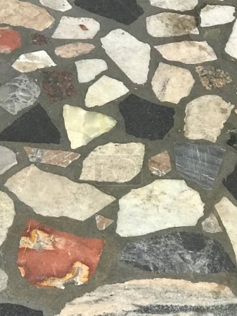 irregularly shaped stones of a wall covering