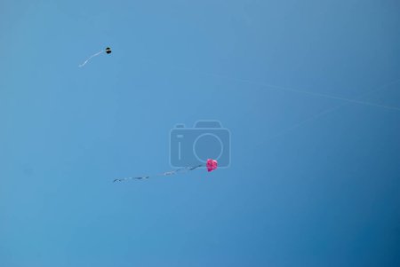 Homemade kites flying in the blue sky