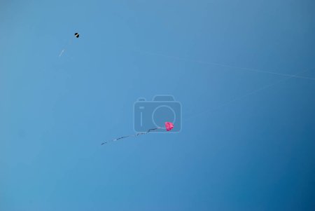 Homemade kites flying in the blue sky