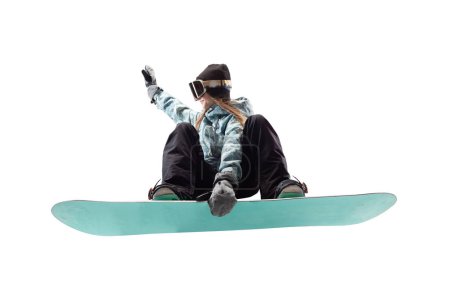 Snowboarder chica en acción aislado en blanco