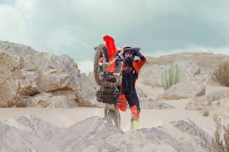Foto de El joven practica andar en moto de tierra. Salpicaduras de arena - Imagen libre de derechos