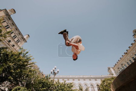 Photo for Parkour. Athlete performing trick in the city. - Royalty Free Image