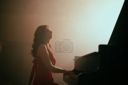 Photo for The woman playing the piano in the concert hall - Royalty Free Image