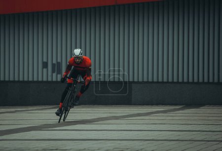 Photo for Young man riding bicycle in city, daytime view - Royalty Free Image