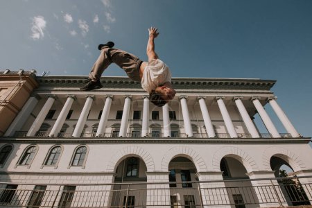 Photo for Parkour. Athlete performing trick in the city. - Royalty Free Image