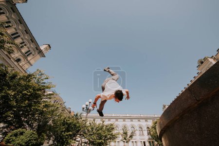 Photo for BMX rider performing tricks on street - Royalty Free Image