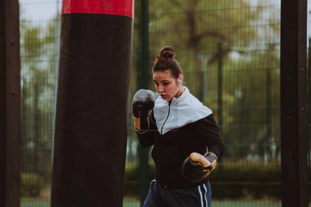 Photo for Woman boxing training outdoor in the morning - Royalty Free Image