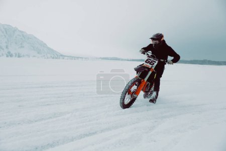 Photo for Winter motocross. Male racer riding on ice. Winter sports. - Royalty Free Image