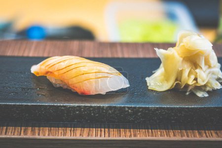 Photo for One serving of japanese nigiri rice sushi served with japanese pickled ginger - Royalty Free Image