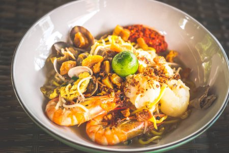 Photo for Fried hokkien mee with scallop, prawn pork, fried lard and samball chilli on the side - Royalty Free Image