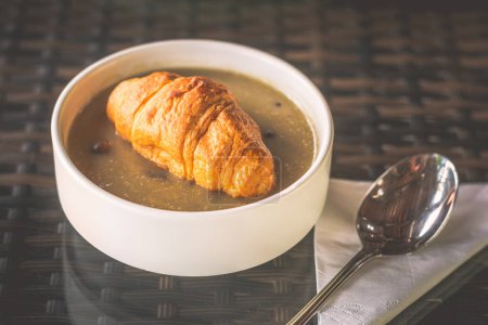 Photo for Espresso mushroom soup with trio of mushroom and topped with a mini croissant - Royalty Free Image