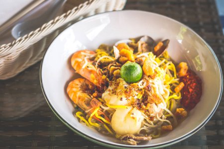 Photo for Fried hokkien mee with scallop, prawn pork, fried lard and samball chilli on the side - Royalty Free Image