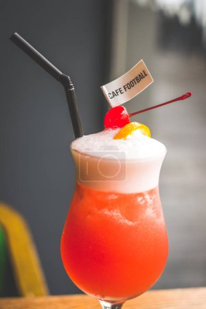 Photo for Football Sling made from Cherry brandy, gin, Dom, pineapple juice, grenadine, soda - Royalty Free Image