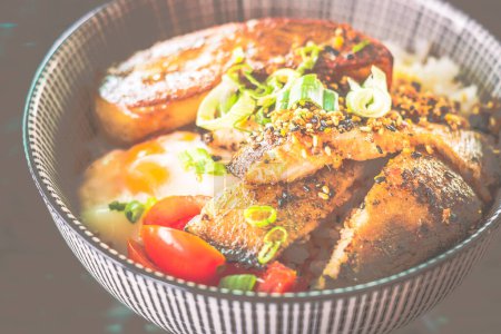 Photo for Grilled Pork Cheek and Foie Gras rice Bowl with onsen soft boil egg - Royalty Free Image