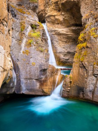 Photo for Waterfall and rocks. Long exposure photography. Waterfall and lake. Natural background and wallpaper. Blurry fast water. - Royalty Free Image