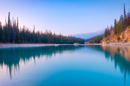 Téléchargez les photos : Nature. Landscape at the day time. Lake and forest in a mountain valley. Natural landscape with a sunset sky. Banff National Park, Alberta, Canada. - en image libre de droit
