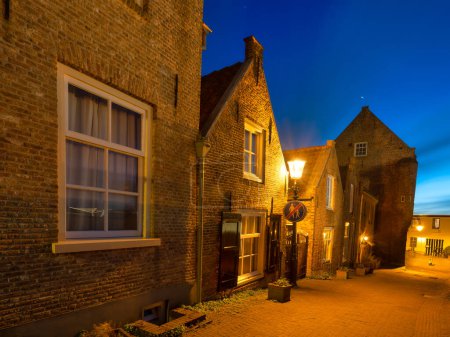 Photo for Architecture in the Woudrichem, Netherlands. Old historical buildings. Architectural landscape. Evening lighting in the city. Postcard view. - Royalty Free Image