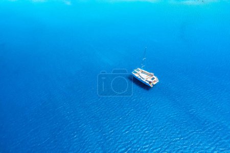 Photo for Drone view of a sailing yacht. Luxury transportation. Vacationing people. Vacation and holidays. Summer time for sea travel. The sea bay. Photo for background and wallpaper. Mediterranean Sea. - Royalty Free Image