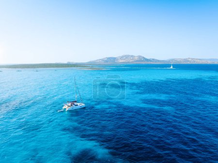 Photo for Drone view of a sailing yacht. Luxury transportation. Vacationing people. Vacation and holidays. Summer time for sea travel. The sea bay. Photo for background and wallpaper. Mediterranean Sea. - Royalty Free Image