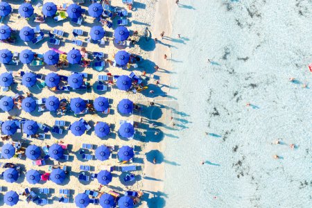 Photo for Aerial view on beach, people and umbrellas. Vacation and adventure. Europe, Mediterranean Sea. Top view from drone at beach and azure sea. View on the coast from drone. - Royalty Free Image