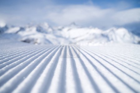 Photo for Snow slope for skiing and snowboarding. Velvet. Winter sports. Slope and mountains. Composition in winter time. Wallpaper and background. - Royalty Free Image